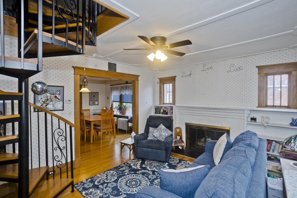 22-24 Eldridge Street Springfield, MA 01108 - Photo 17 of 41 a living room with furniture and a fireplace