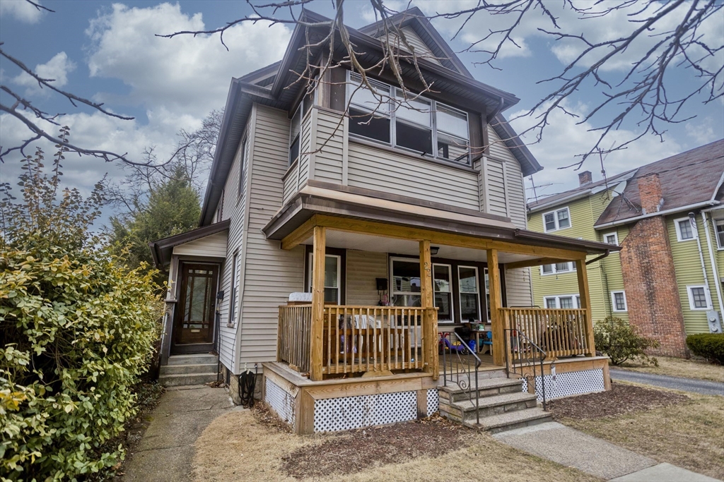 22-24 Eldridge Street Springfield, MA 01108 - Photo 2 of 41 a view of a house with a small yard and large tree