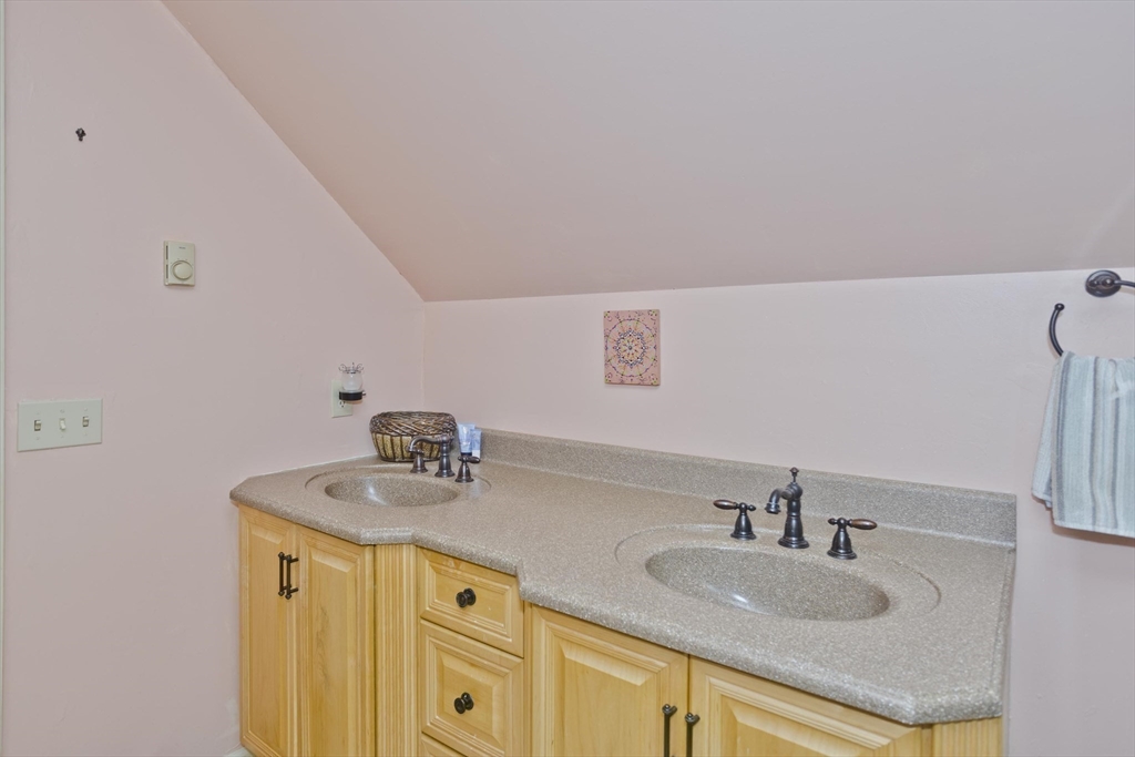 22-24 Eldridge Street Springfield, MA 01108 - Photo 24 of 41 a bathroom with a sink and a mirror