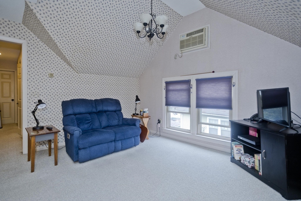 22-24 Eldridge Street Springfield, MA 01108 - Photo 25 of 41 a living room with furniture and a flat screen tv