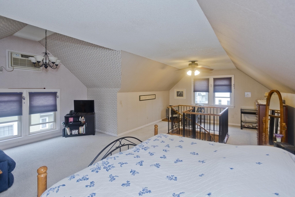 22-24 Eldridge Street Springfield, MA 01108 - Photo 29 of 41 a living room with furniture and a large window