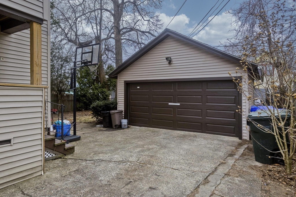 22-24 Eldridge Street Springfield, MA 01108 - Photo 3 of 41 a view of backyard with small cabin and a chair