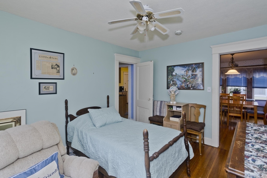 22-24 Eldridge Street Springfield, MA 01108 - Photo 32 of 41 a bedroom with a bed a couch and dresser