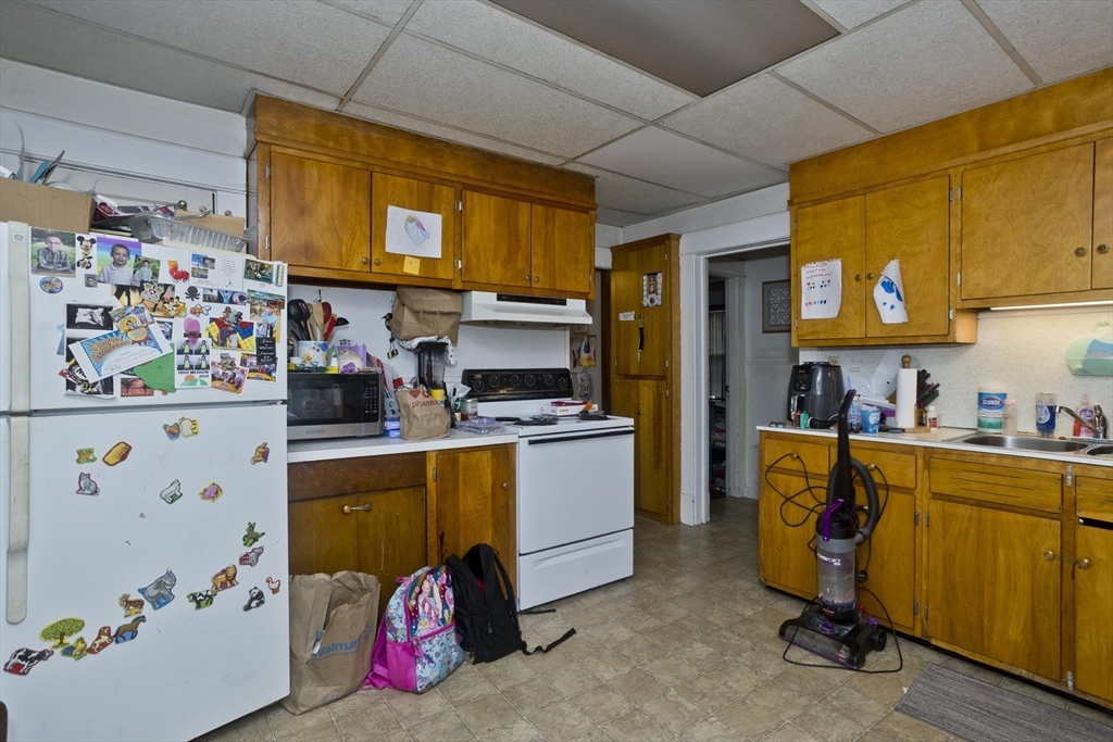 22-24 Eldridge Street Springfield, MA 01108 - Photo 34 of 41 a kitchen with a refrigerator and sink