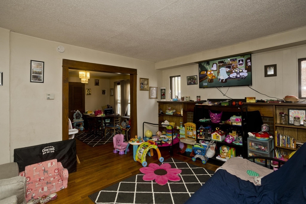 22-24 Eldridge Street Springfield, MA 01108 - Photo 36 of 41 a room with lots of furniture and couch