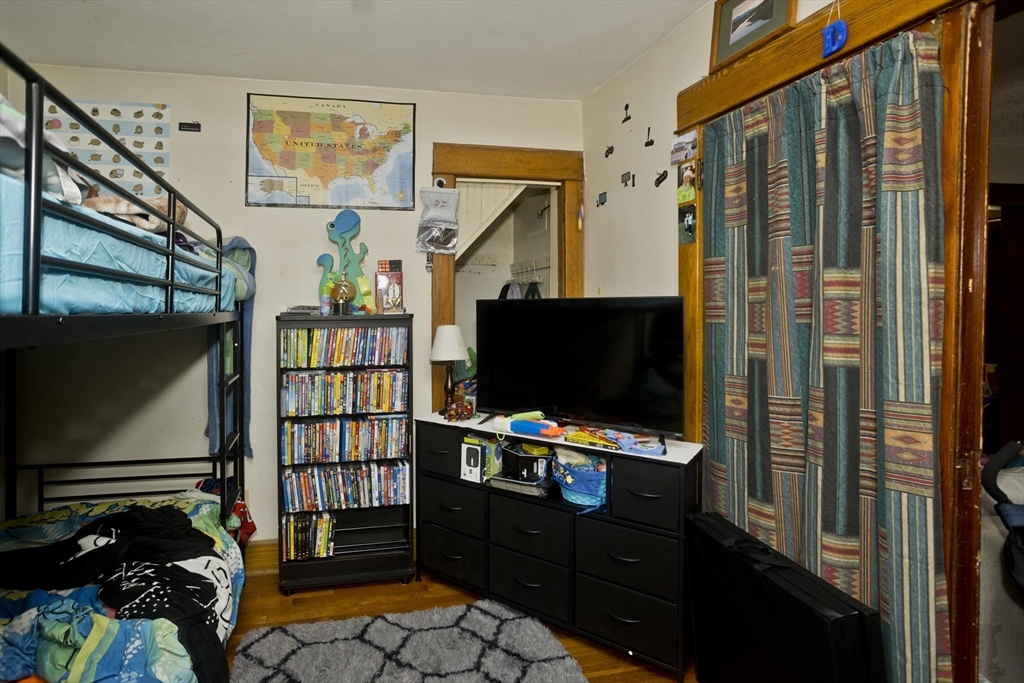 22-24 Eldridge Street Springfield, MA 01108 - Photo 39 of 41 a living room with furniture and a flat screen tv