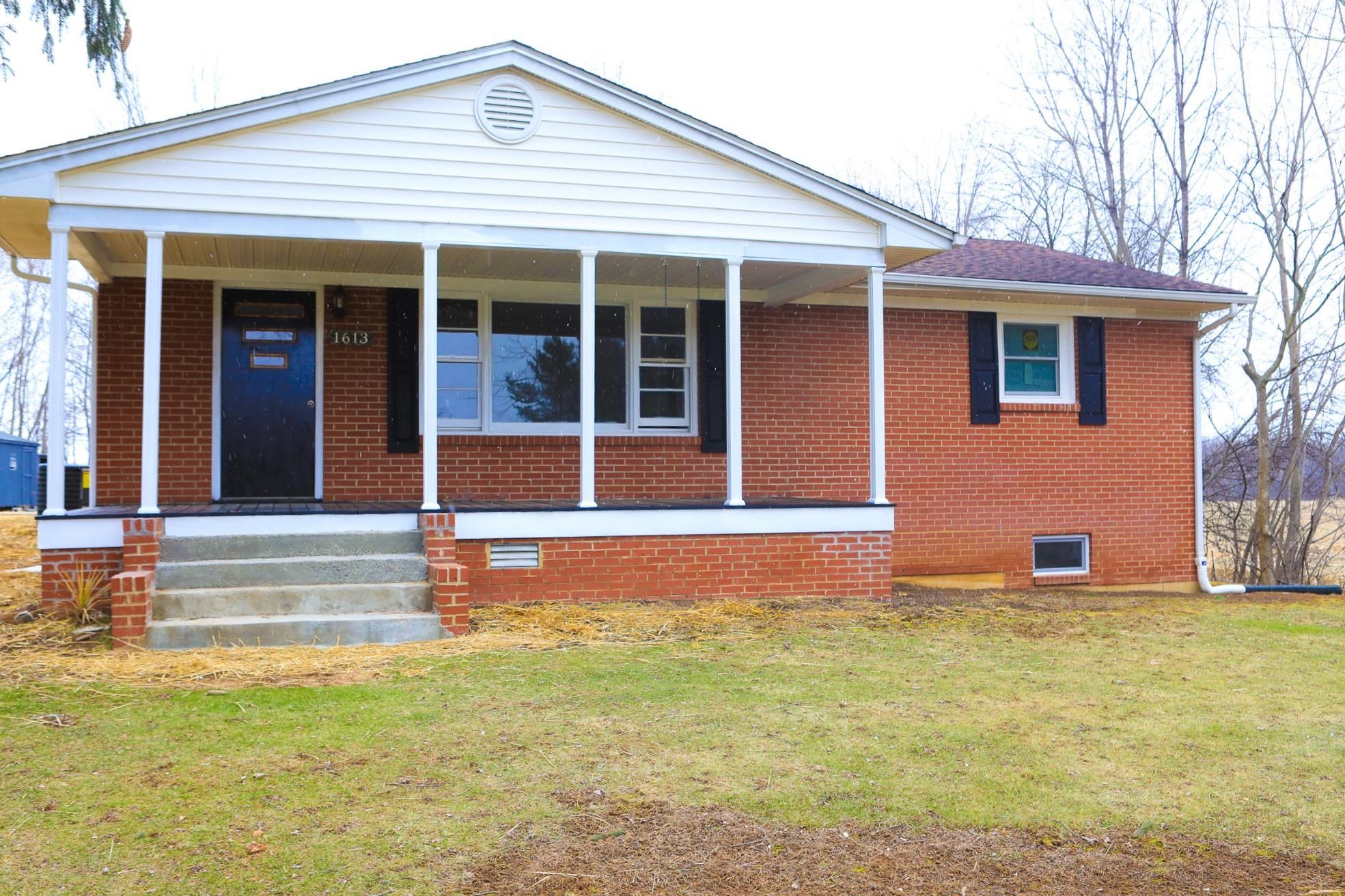 1613 Howardsville Road Staunton, VA 24401 - Photo 1 of 41 a front view of a house with a yard
