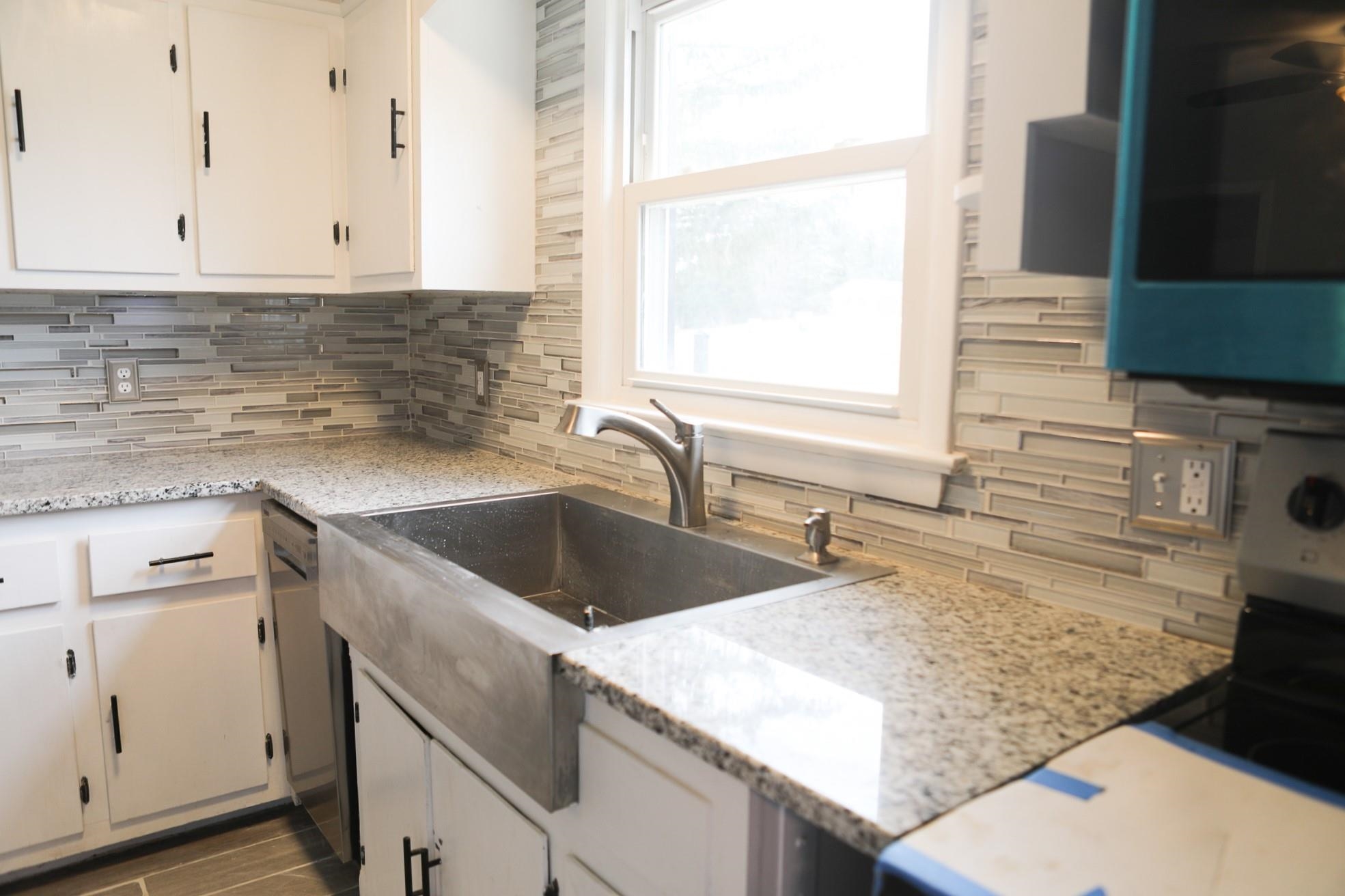 1613 Howardsville Road Staunton, VA 24401 - Photo 11 of 41 a kitchen with granite countertop a sink and a stove