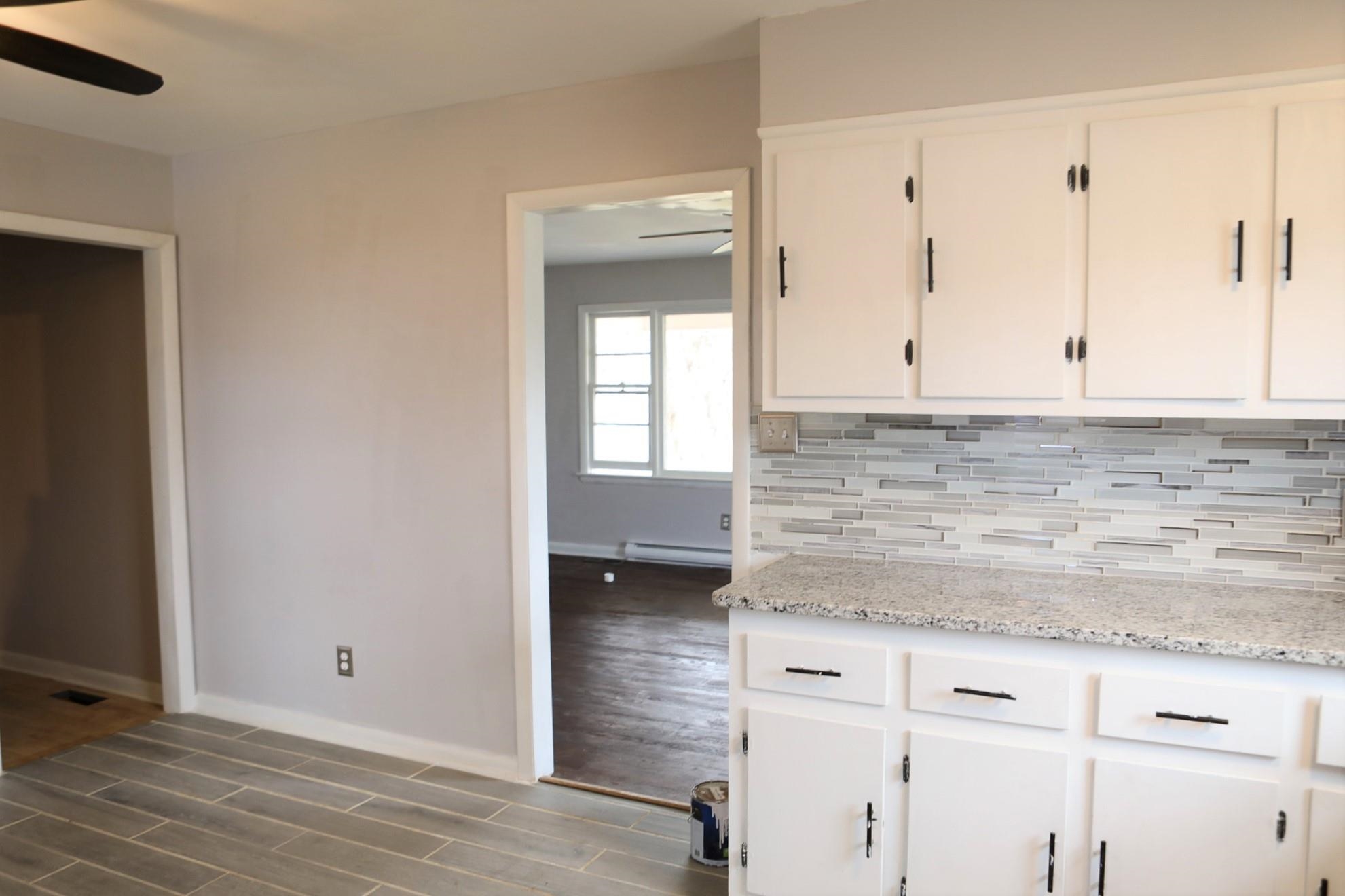 1613 Howardsville Road Staunton, VA 24401 - Photo 14 of 41 a view of granite countertop white cabinets and window