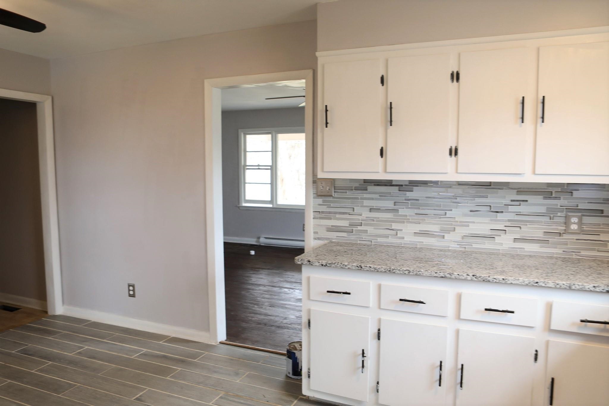 1613 Howardsville Road Staunton, VA 24401 - Photo 15 of 41 a view of kitchen with granite countertop white cabinets and white appliances