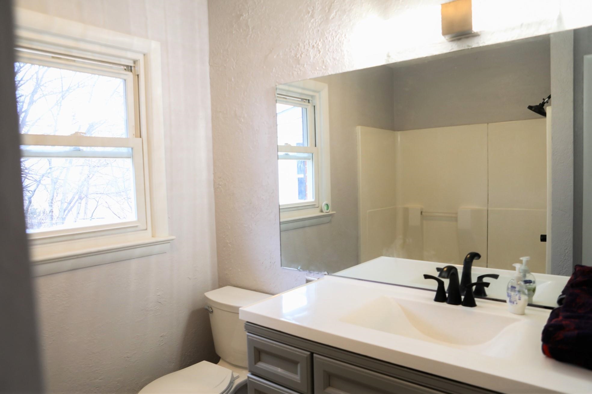 1613 Howardsville Road Staunton, VA 24401 - Photo 28 of 41 a bathroom with a sink a toilet and window