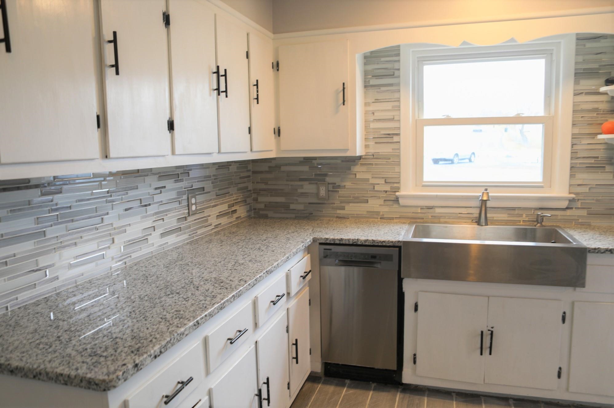 1613 Howardsville Road Staunton, VA 24401 - Photo 8 of 41 a kitchen with granite countertop a sink and a window