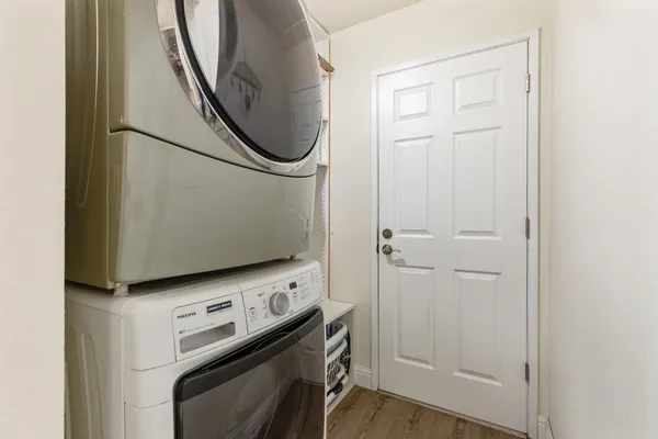 a view of a storage and utility room with washer and dryer