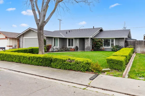 a front view of a house with garden