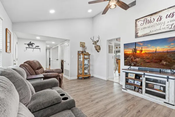 a living room with furniture and a flat screen tv
