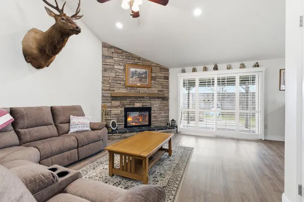 a living room with furniture and a fireplace