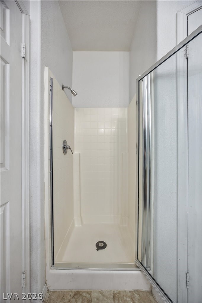 10550 West Alexander Road, Unit 2164 Las Vegas, NV 89129 - Photo 18 of 27 A compact walk-in shower offers a practical and refreshing cleansing space.