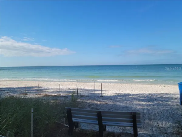 a view of a lake with a yard