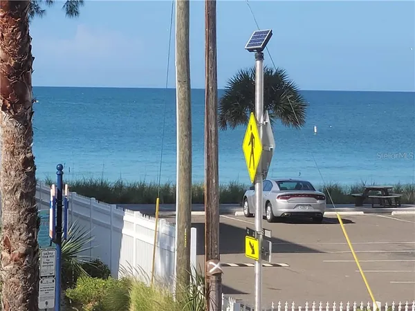 a view of a swimming pool with a lounge chairs