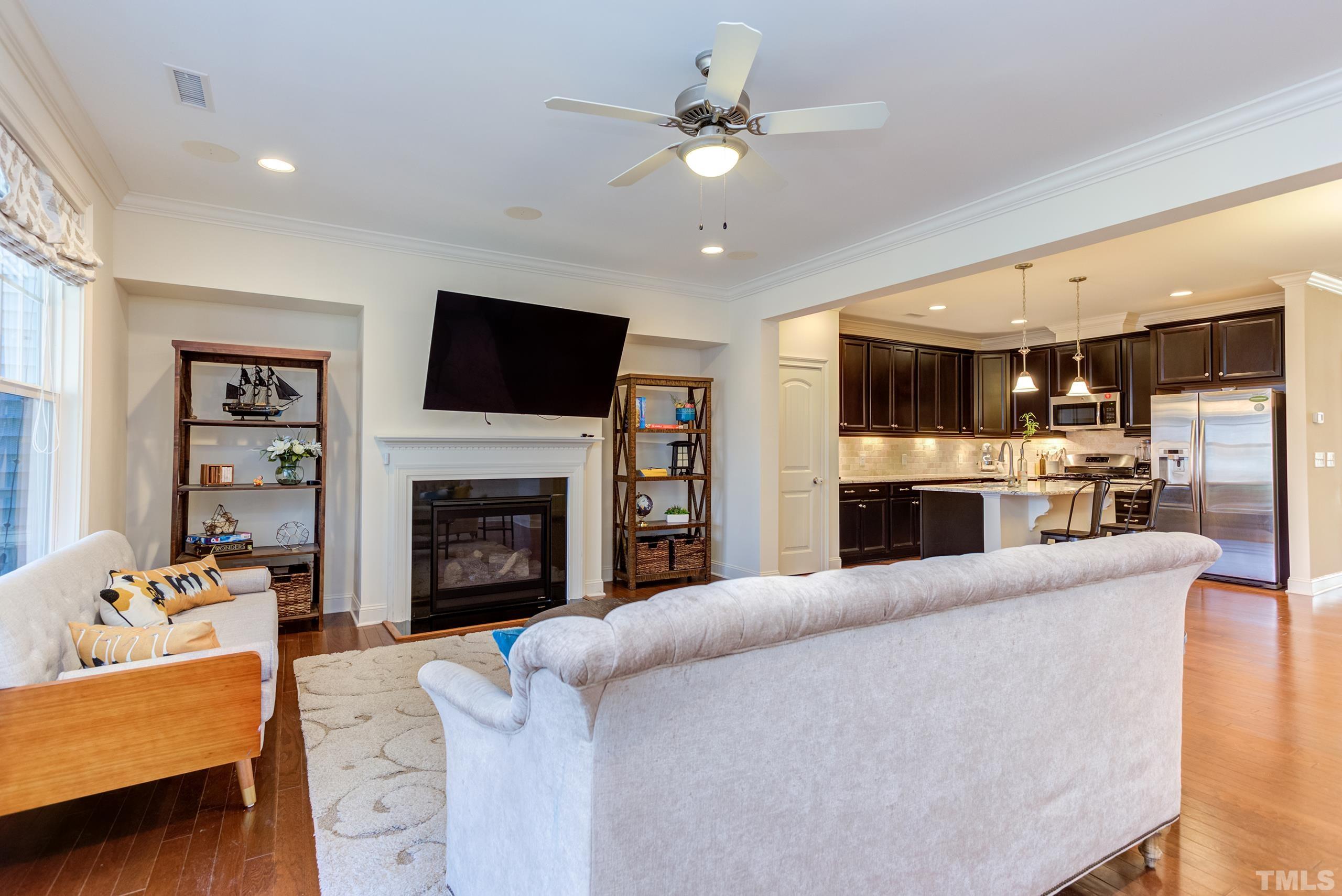 449 Talons Rest Way Cary, NC 27513 - Photo 12 of 54 a living room with fireplace furniture and a flat screen tv
