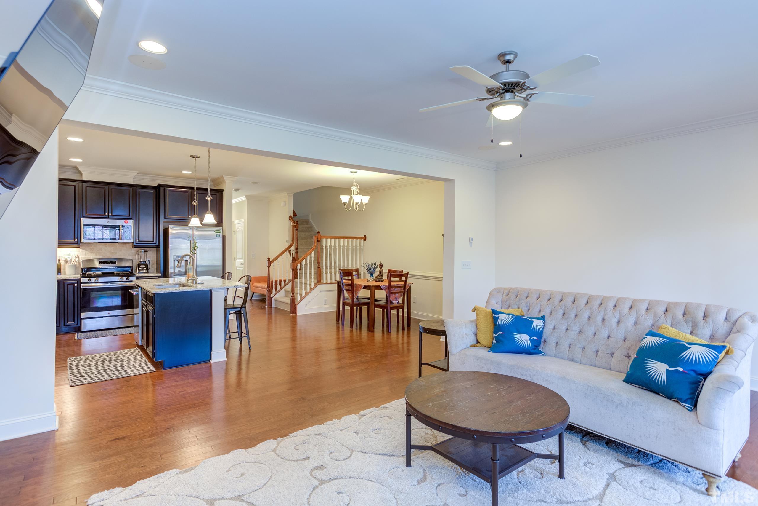 449 Talons Rest Way Cary, NC 27513 - Photo 22 of 54 a living room with furniture and kitchen view
