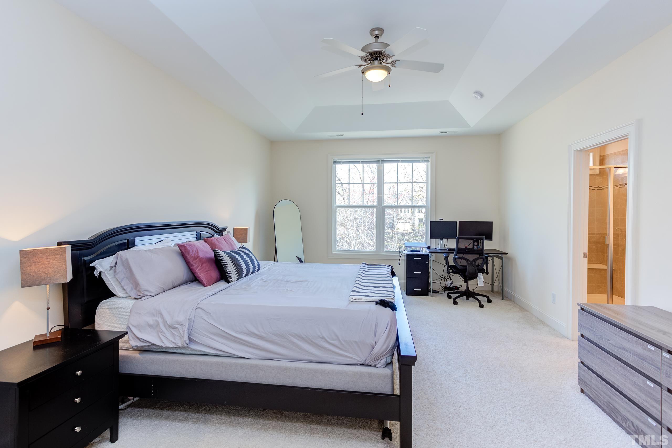 449 Talons Rest Way Cary, NC 27513 - Photo 29 of 54 a bedroom with a bed couch and a window