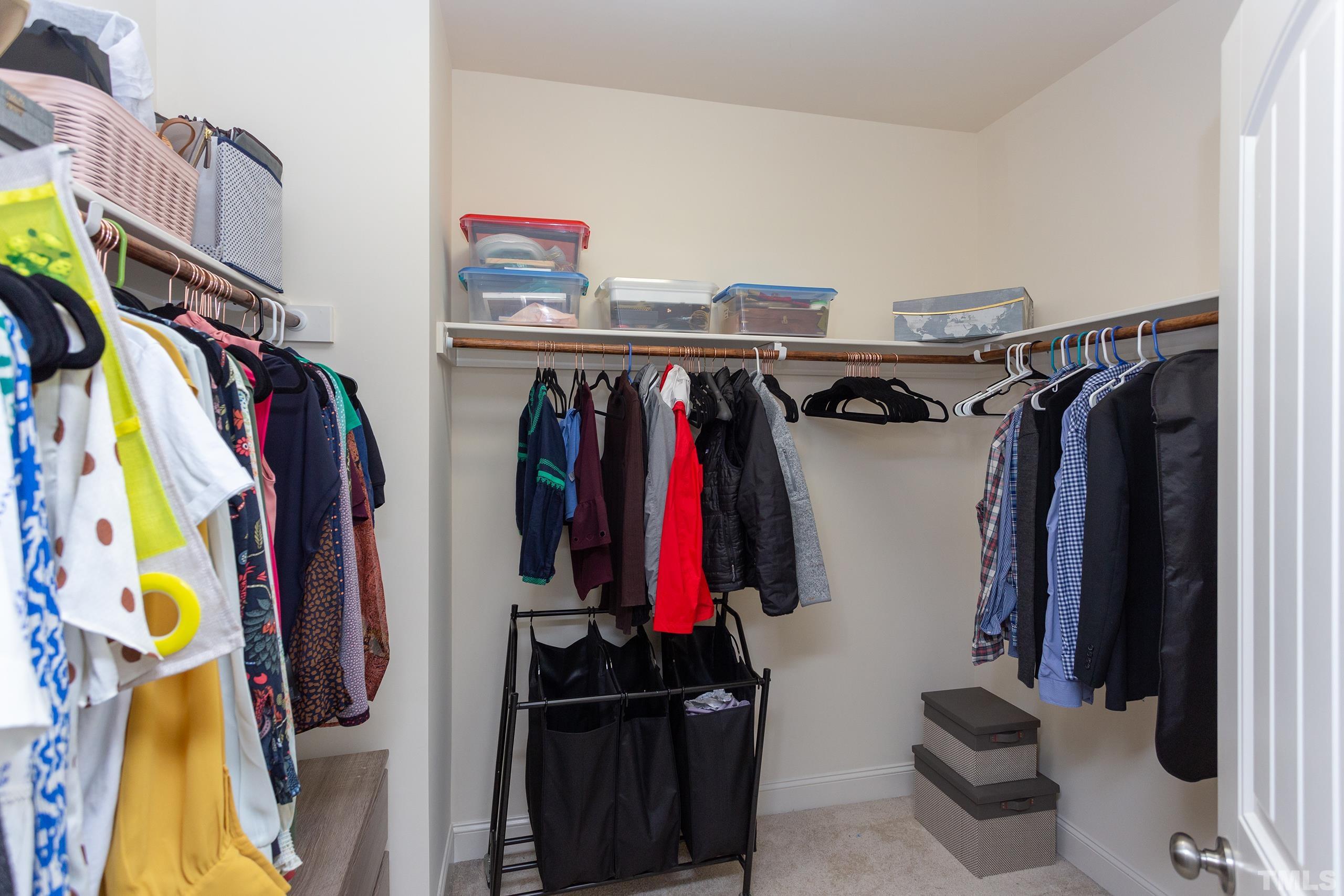 449 Talons Rest Way Cary, NC 27513 - Photo 35 of 54 a view of walk in closet with clothes and shoes