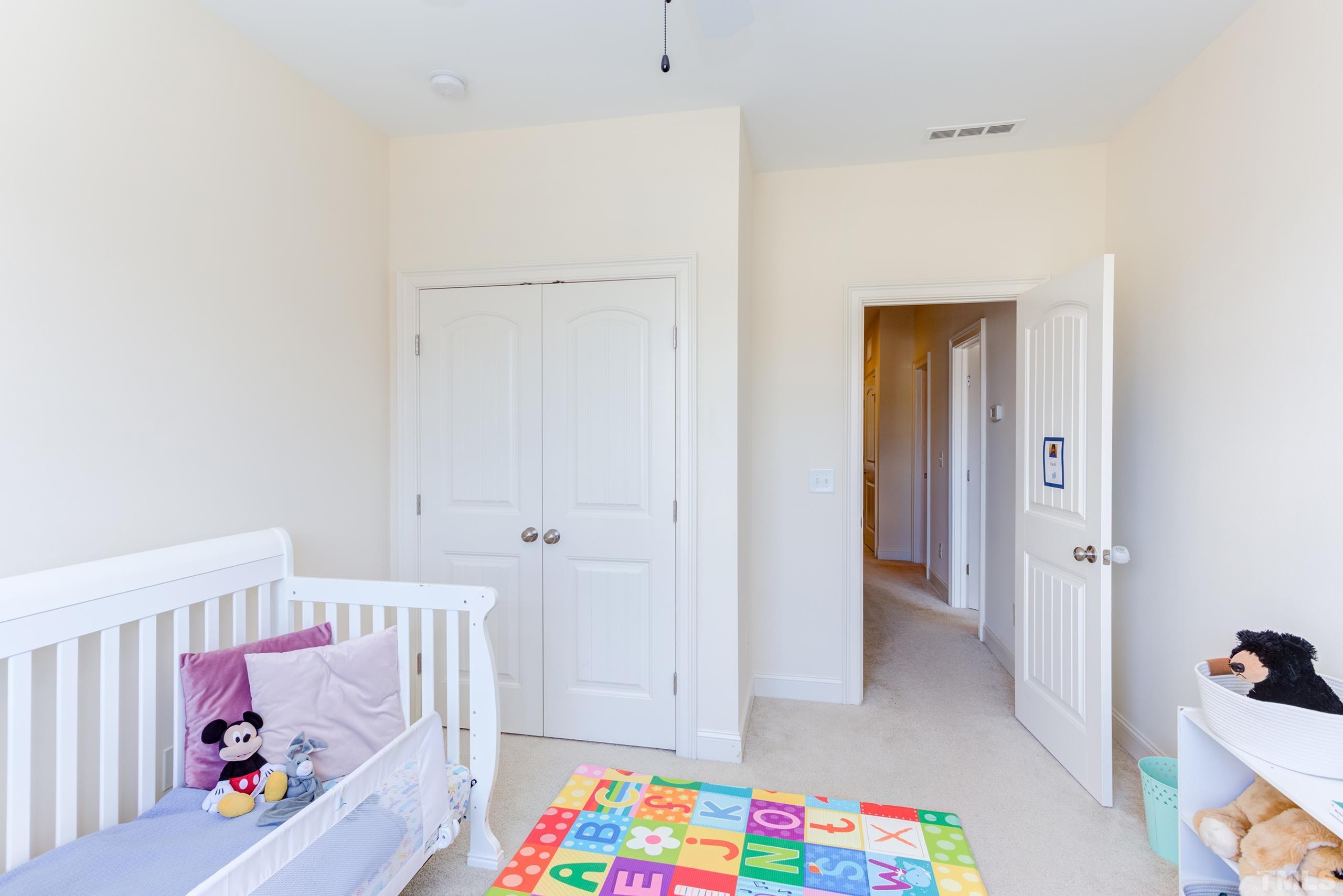 449 Talons Rest Way Cary, NC 27513 - Photo 36 of 54 a view of room with baby crib and lounge chair