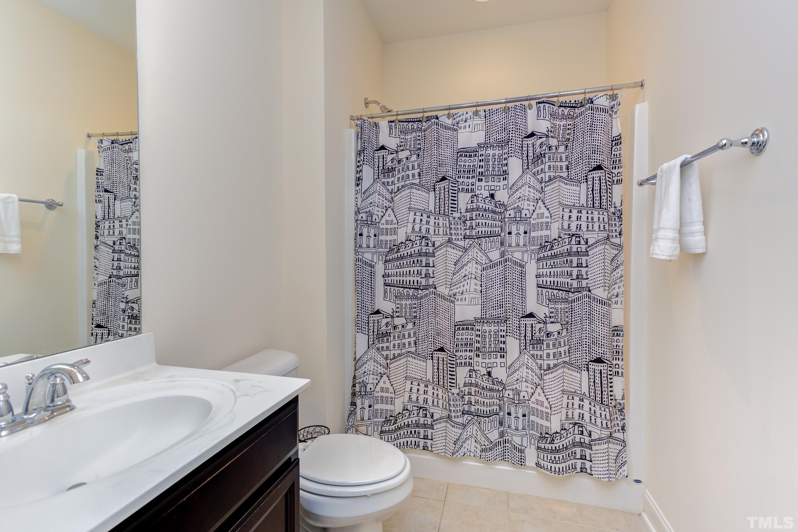 449 Talons Rest Way Cary, NC 27513 - Photo 38 of 54 a bathroom with a sink a toilet and shower