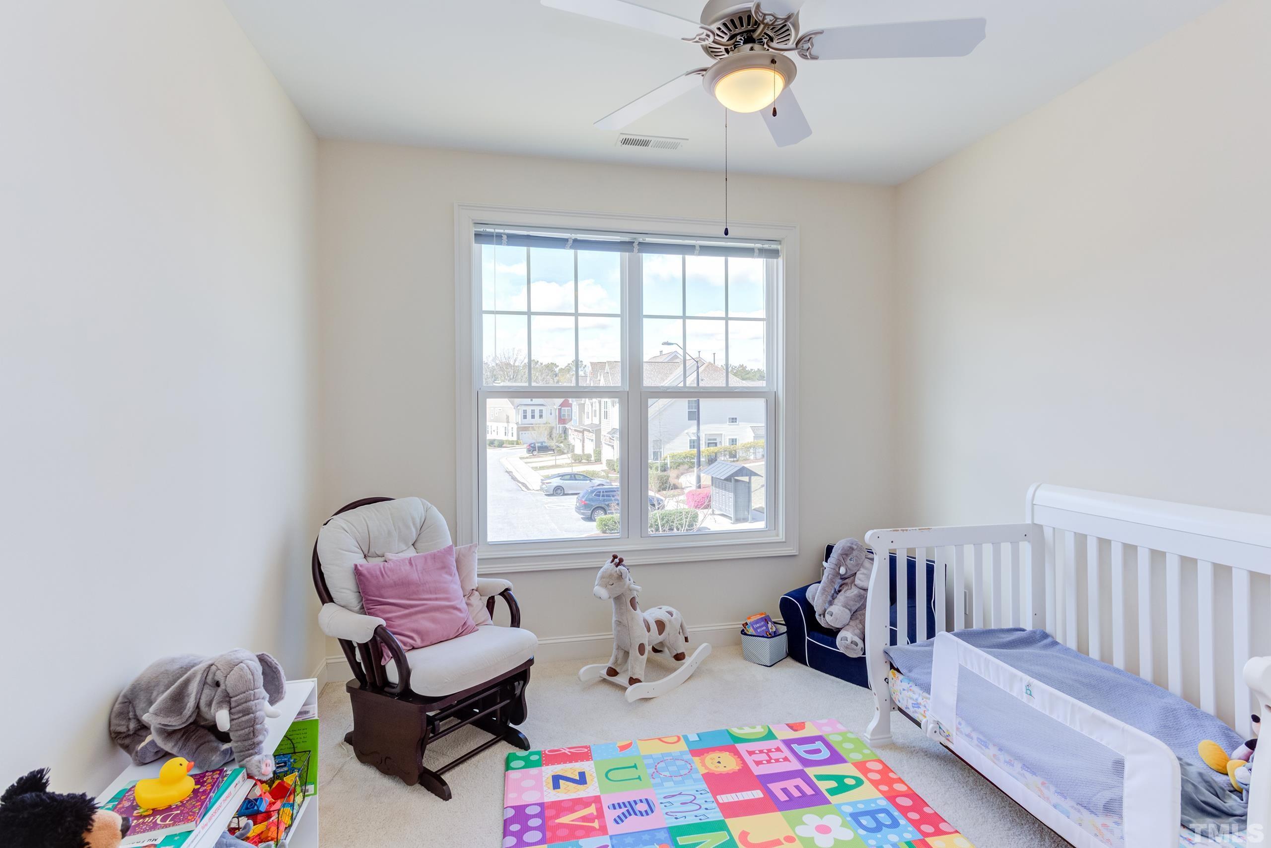 449 Talons Rest Way Cary, NC 27513 - Photo 39 of 54 a bedroom with furniture and a window