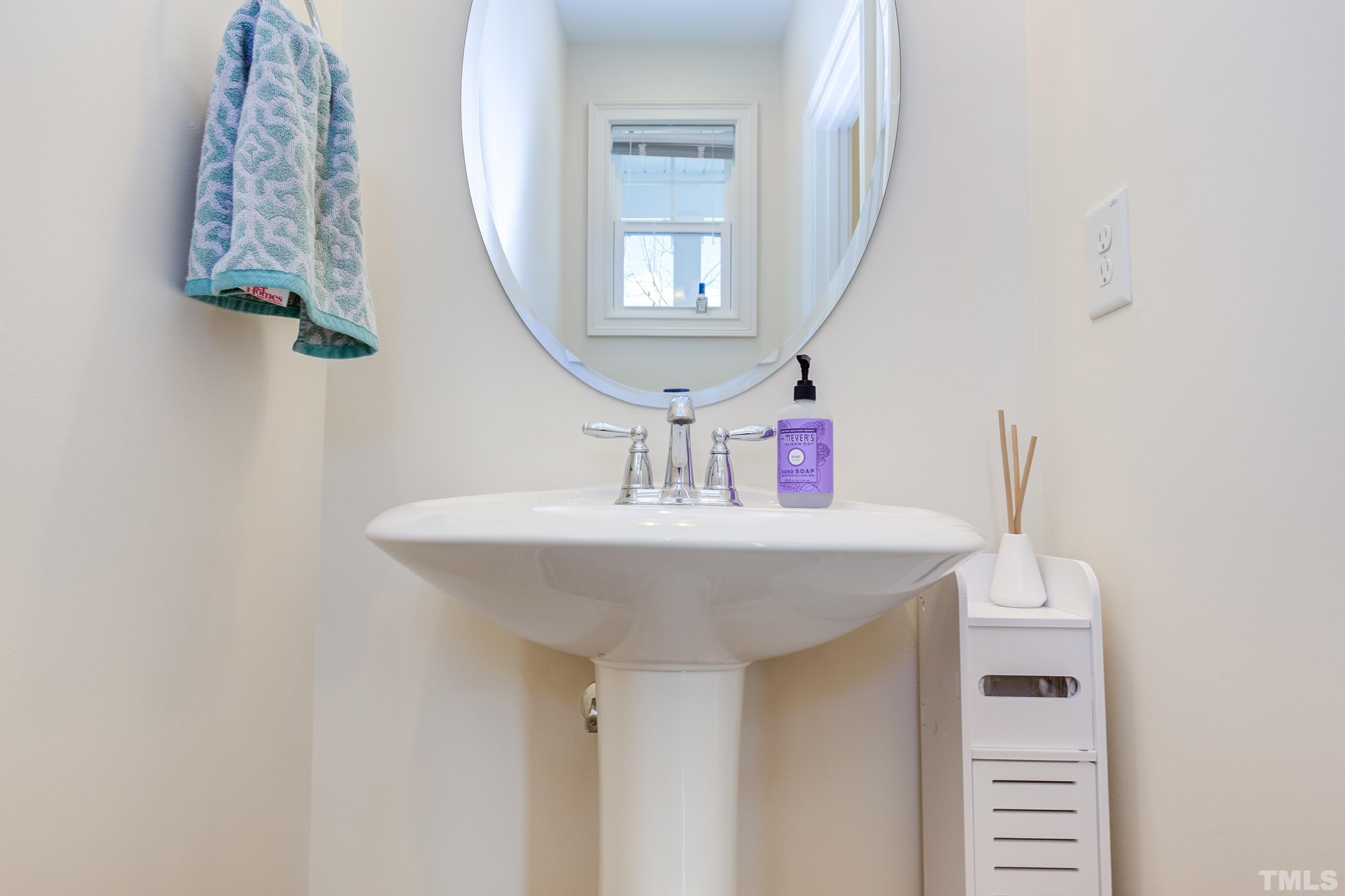 449 Talons Rest Way Cary, NC 27513 - Photo 42 of 54 a bathroom with a sink and a mirror