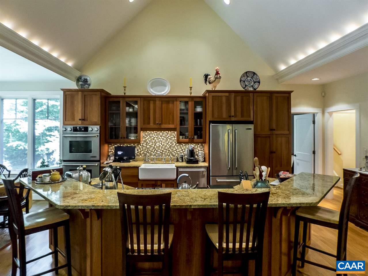 2707 Heartwood Road Afton, VA 22920 - Photo 11 of 31 a kitchen with granite countertop a dining table and chairs