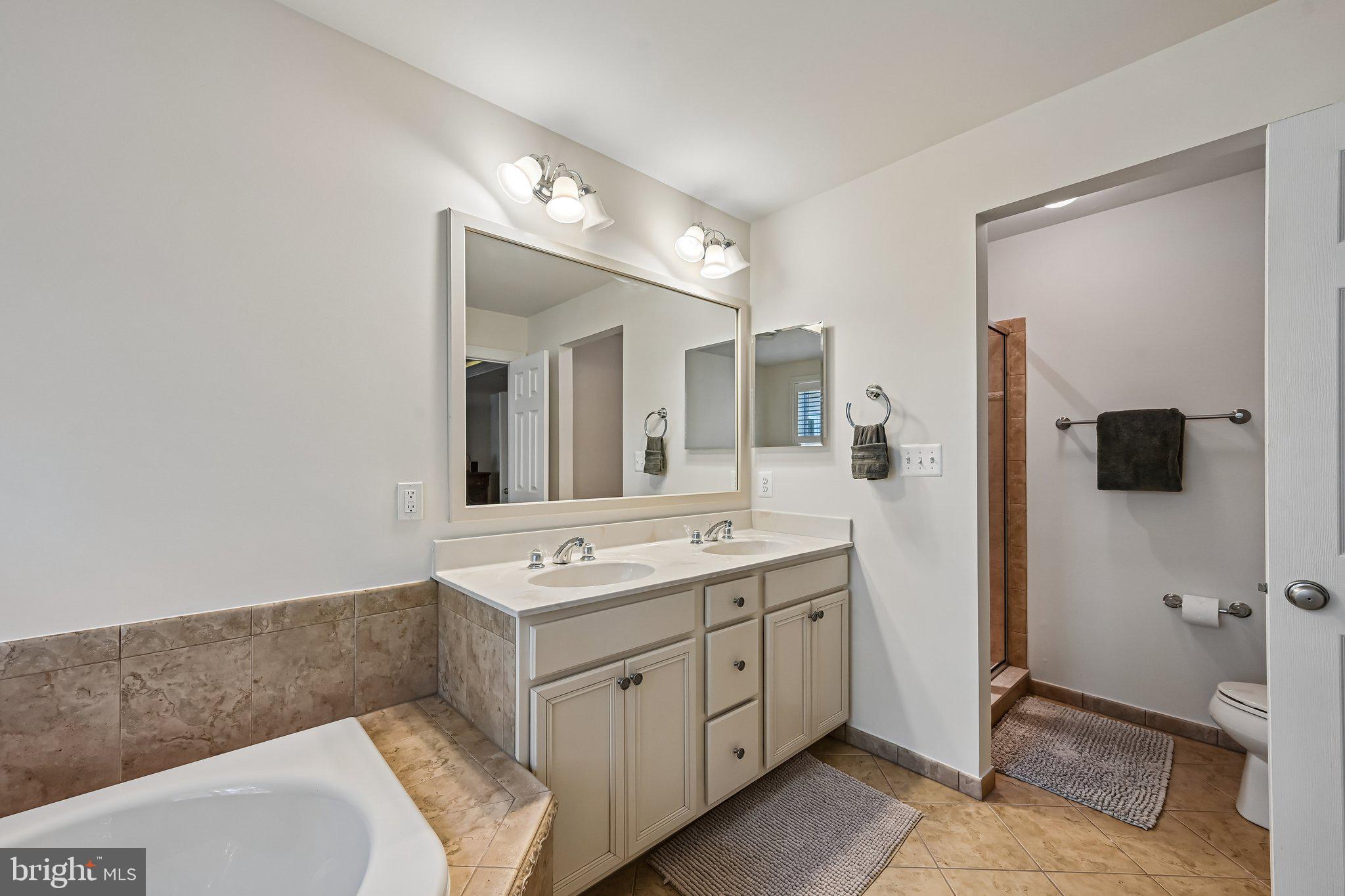 2271 Brimstone Place Hanover, MD 21076 - Photo 45 of 62 Elegant dual-sink bathroom retreat.