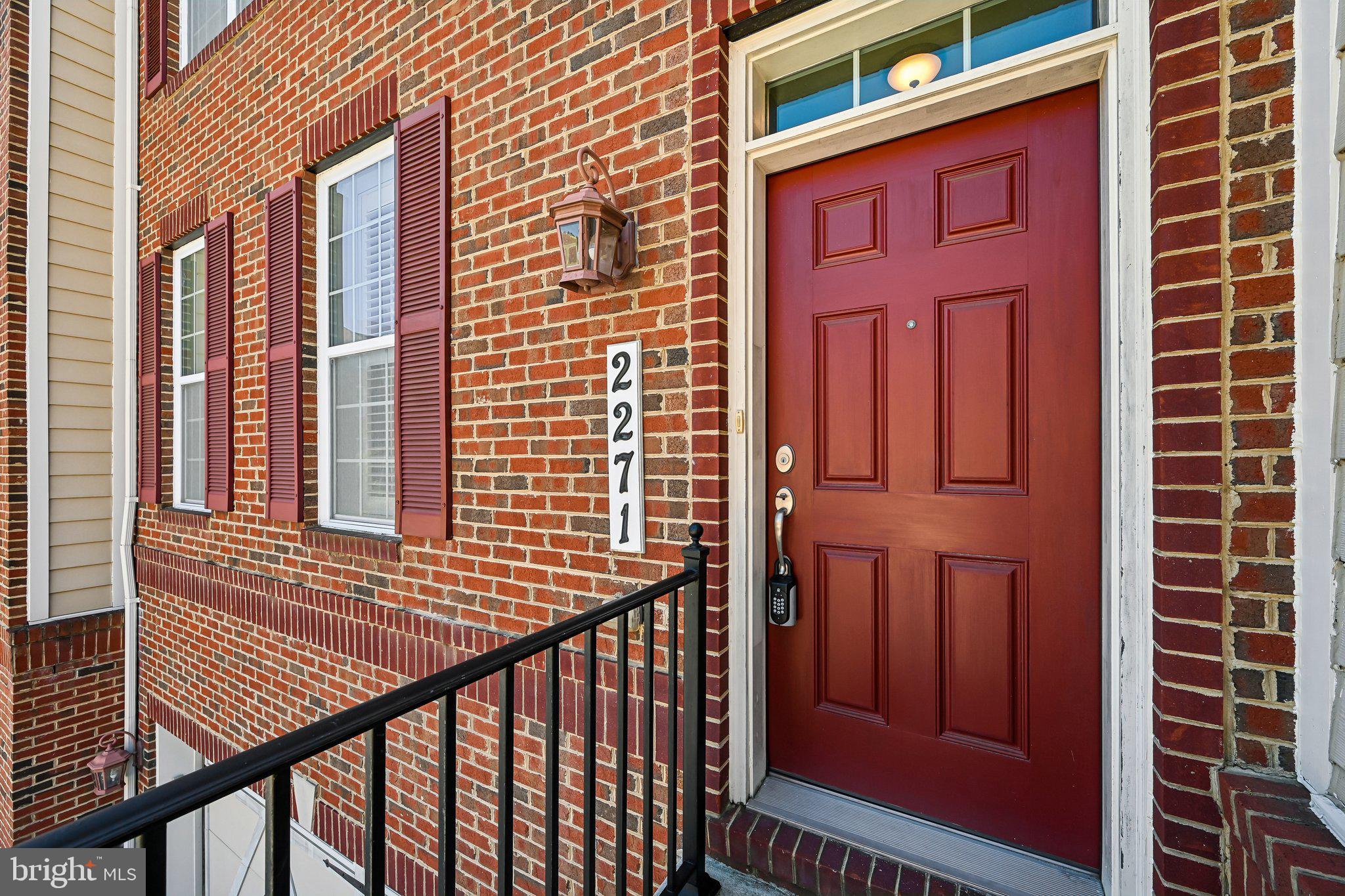 2271 Brimstone Place Hanover, MD 21076 - Photo 5 of 62 Charming entryway with rich brickwork.