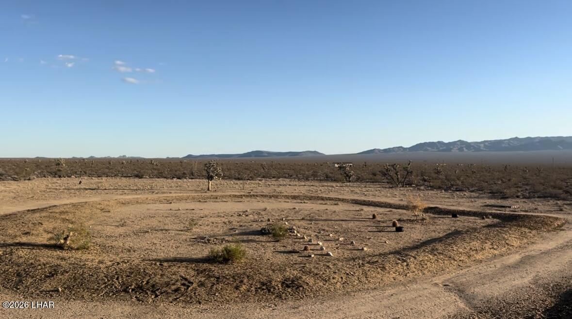 18206 South Gene Autry Road Yucca, AZ 86438 - Photo 13 of 17 a view of an ocean beach and mountain
