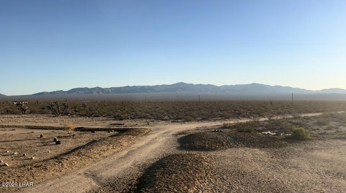 18206 South Gene Autry Road Yucca, AZ 86438 - Photo 15 of 17 a view of an outdoor space and mountain view