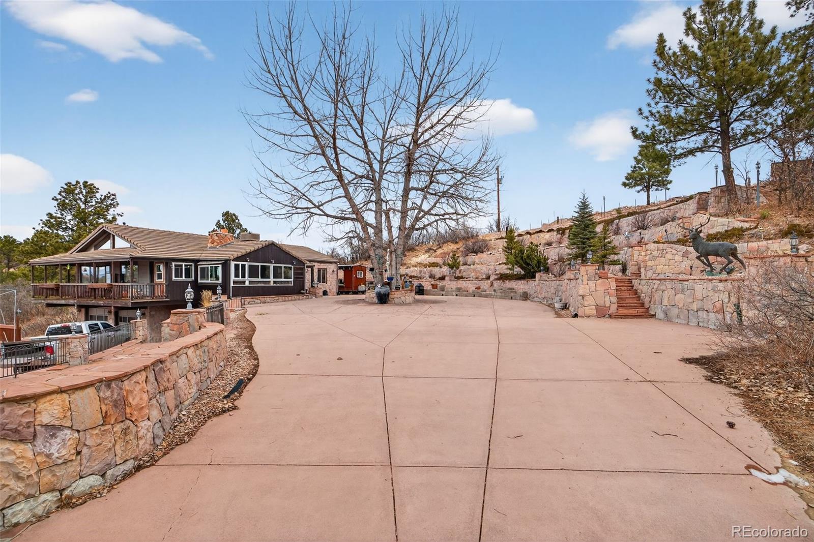450 East Happy Canyon Road Castle Rock, CO 80108 - Photo 14 of 48 a view of house with yard