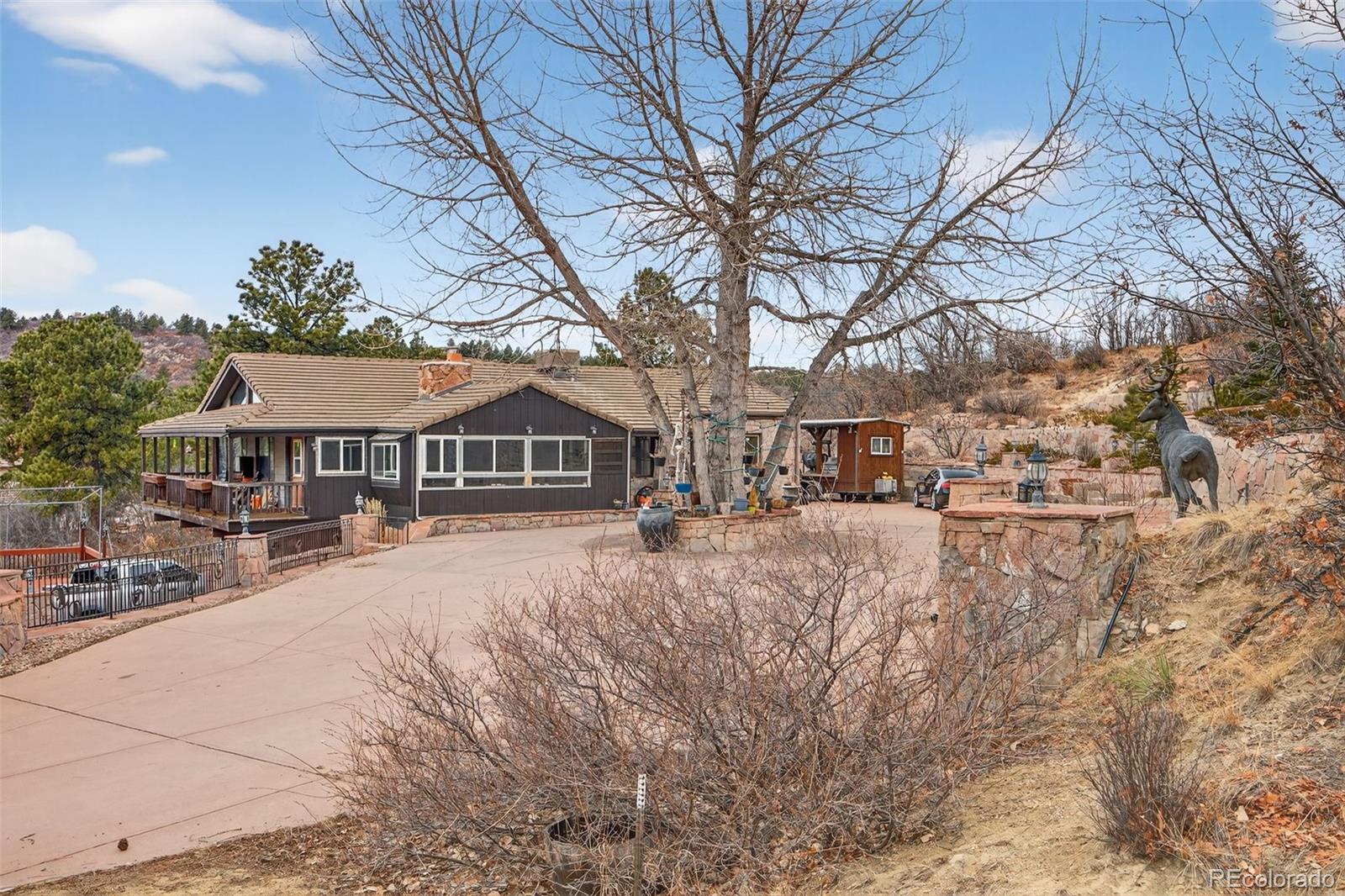 450 East Happy Canyon Road Castle Rock, CO 80108 - Photo 27 of 48 a view of house with yard in front of it