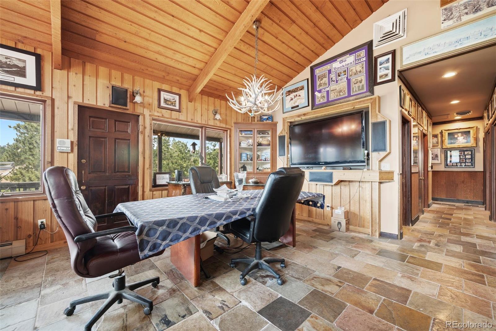 450 East Happy Canyon Road Castle Rock, CO 80108 - Photo 33 of 48 a view of a workspace with furniture and a window