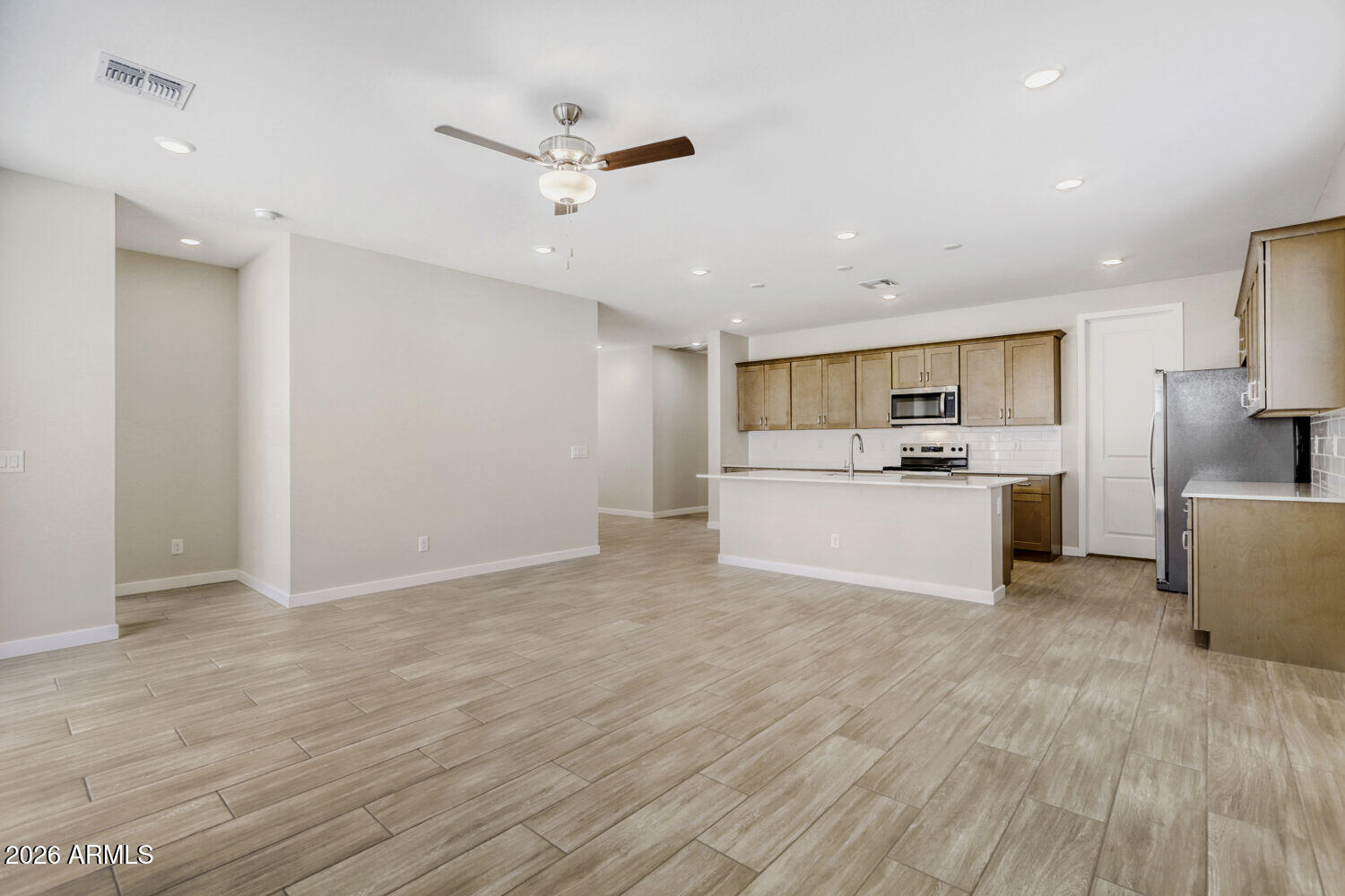 24193 West Atlantis Way Buckeye, AZ 85326 - Photo 2 of 21 Greatroom and kitchen