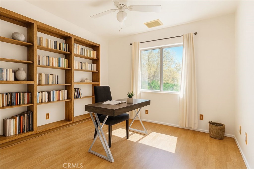 4530 West Ridgecrest Boulevard Ridgecrest, CA 93555 - Photo 15 of 18 a view of a workspace with furniture and a bookshelf