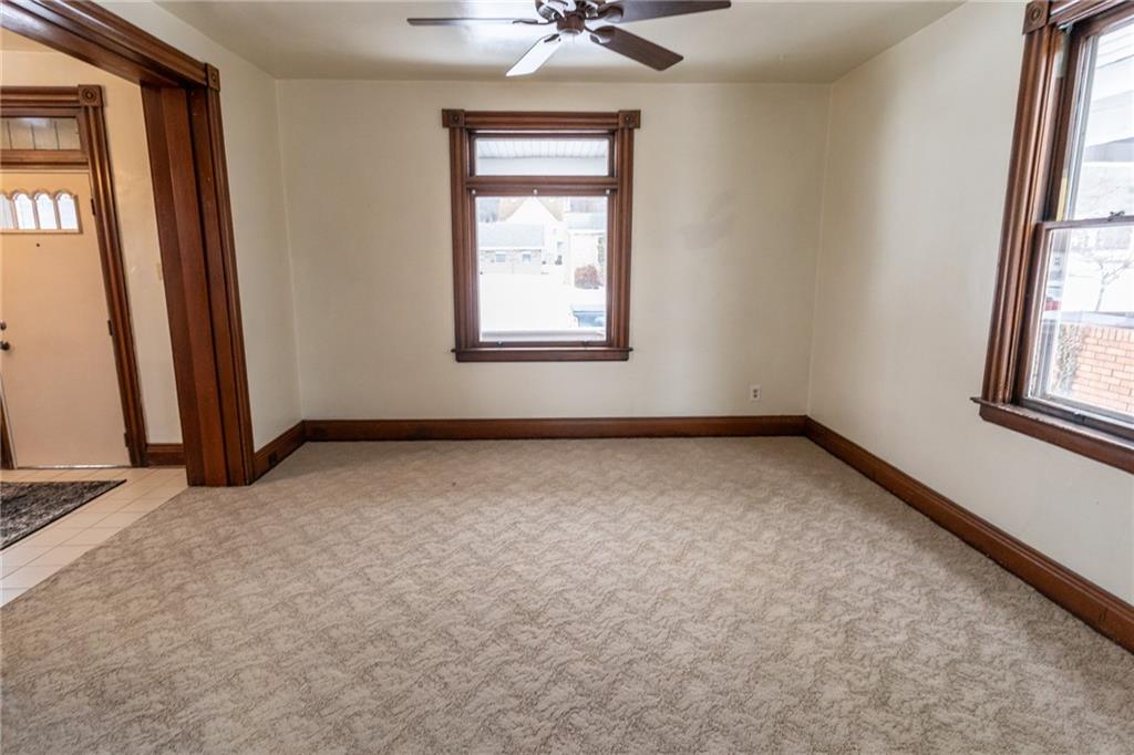 1206 Sycamore Street Connellsville, PA 15425 - Photo 12 of 35 an empty room with windows and fan