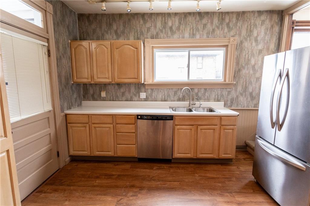 1206 Sycamore Street Connellsville, PA 15425 - Photo 17 of 35 a kitchen with a sink cabinets and window