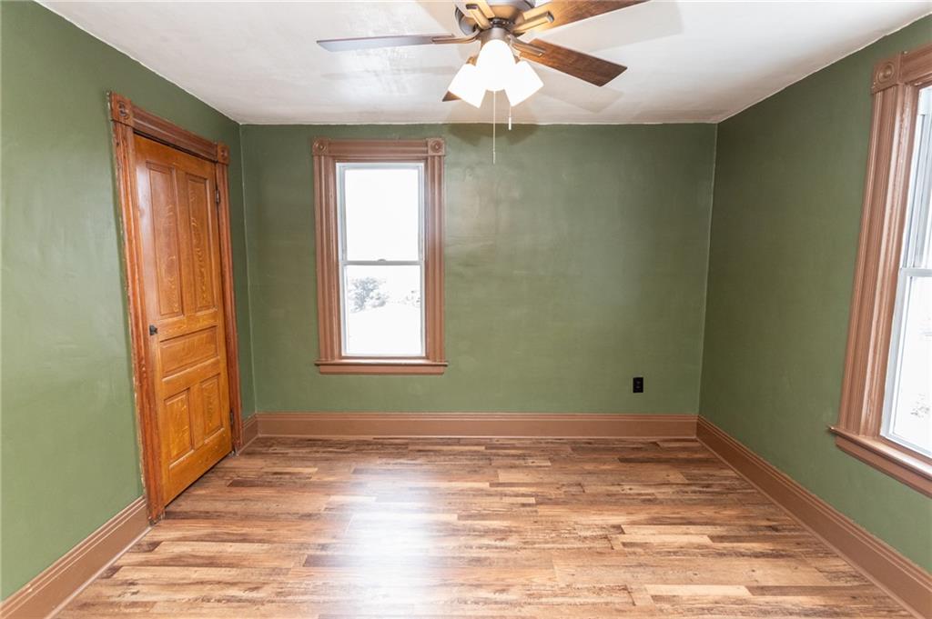 1206 Sycamore Street Connellsville, PA 15425 - Photo 20 of 35 a view of an empty room with wooden floor and a window
