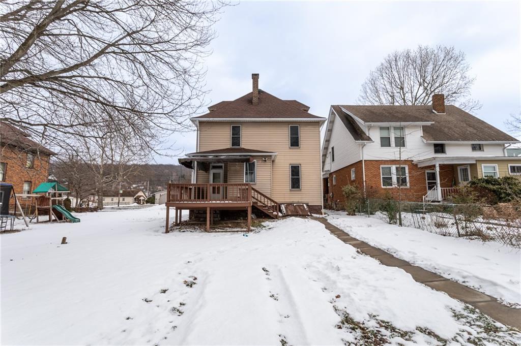 1206 Sycamore Street Connellsville, PA 15425 - Photo 2 of 35 a view of a house with a bench in snow