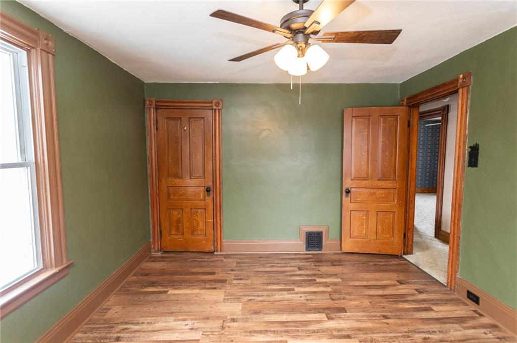 1206 Sycamore Street Connellsville, PA 15425 - Photo 21 of 35 an empty room with windows and fan
