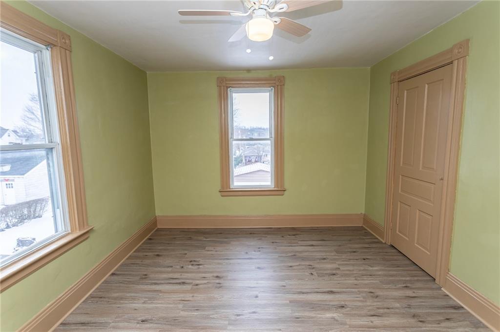 1206 Sycamore Street Connellsville, PA 15425 - Photo 23 of 35 a view of an empty room with wooden floor and a window
