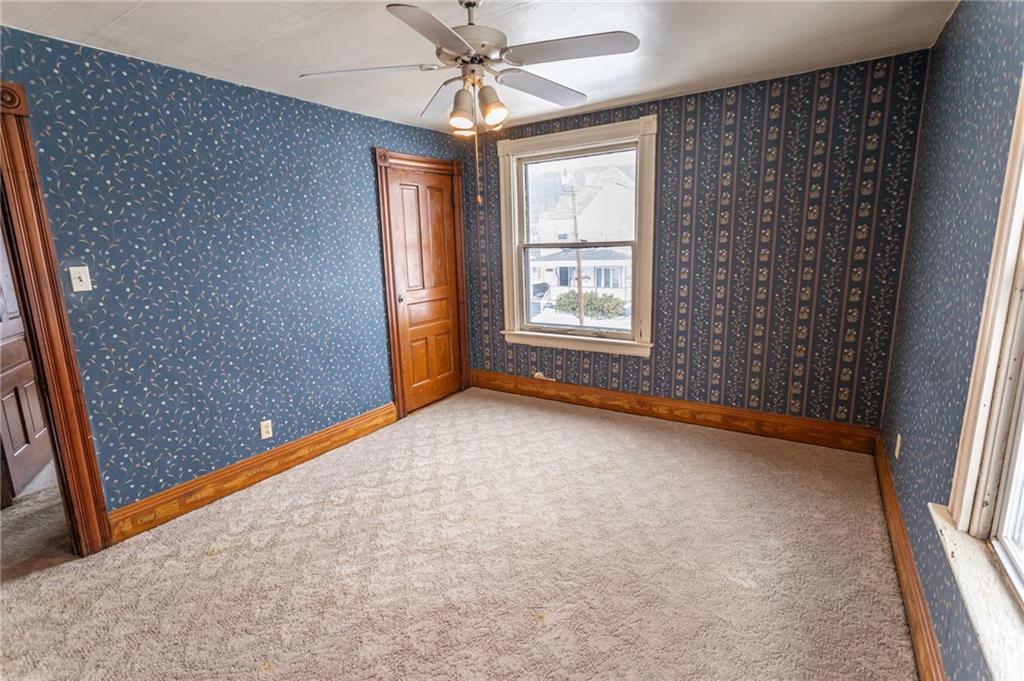 1206 Sycamore Street Connellsville, PA 15425 - Photo 27 of 35 an empty room with windows and fan