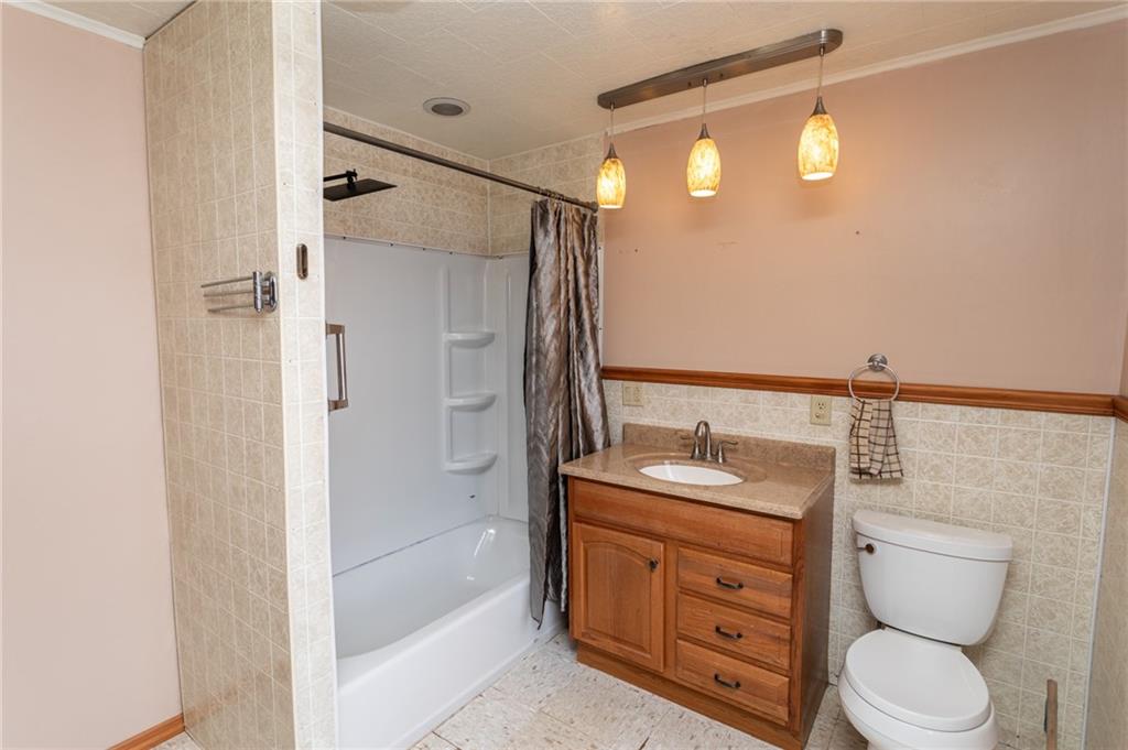 1206 Sycamore Street Connellsville, PA 15425 - Photo 29 of 35 a bathroom with a sink a toilet and shower