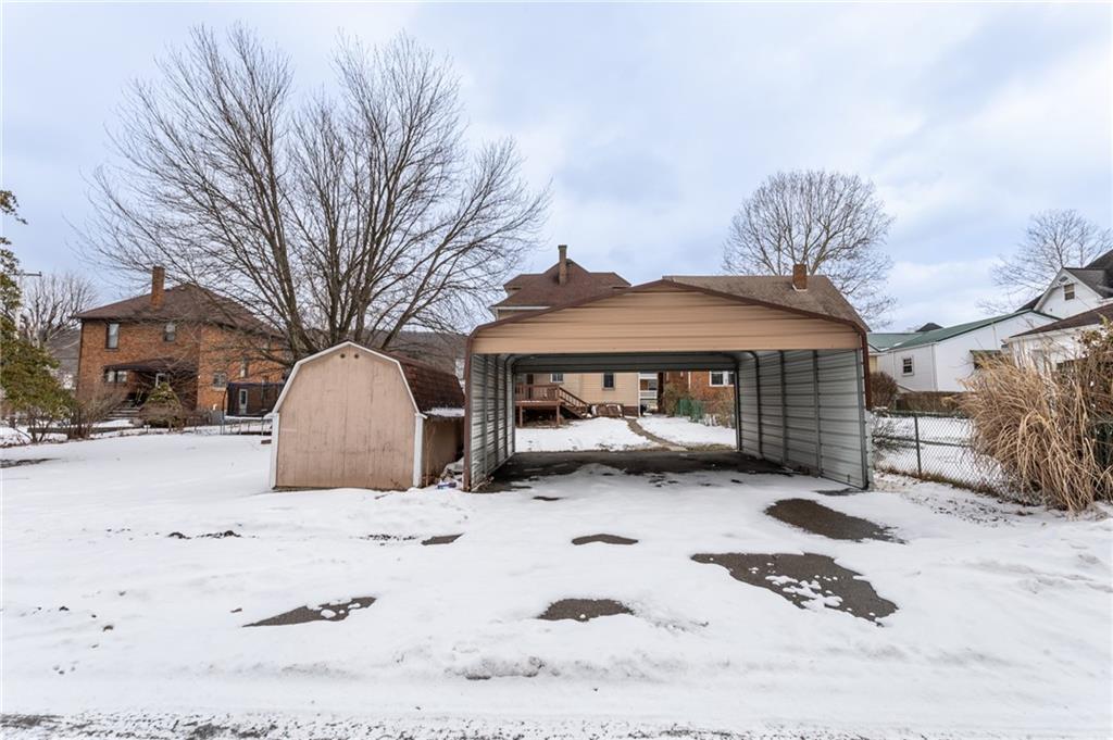 1206 Sycamore Street Connellsville, PA 15425 - Photo 5 of 35 a view of a yard covered with snow in front of house
